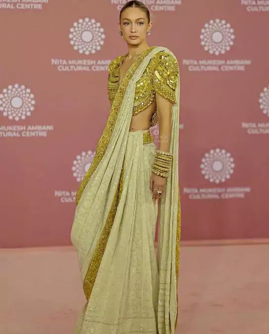 Gigi Hadid stole our hearts and minds in this gold and white saree